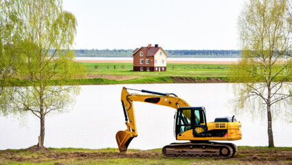 Yellow excavator is on a construction site
