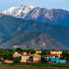 Obraz premium Mountain village nestled in a valley