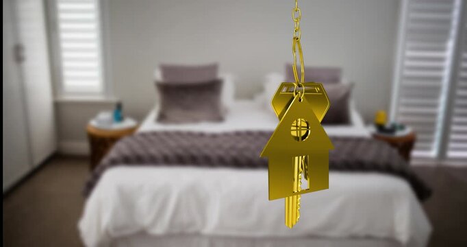 Animation of gold house key fob and key hanging in front of blurred house with sold sign