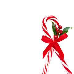 Png 3d illustration of festive candy canes with red ribbon and holly isolated on transparent background transparent background