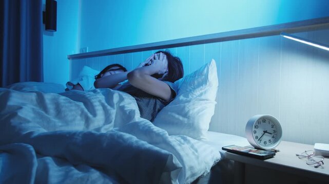 Asian single mum is sleepless, with mobile phone and social media addiction.