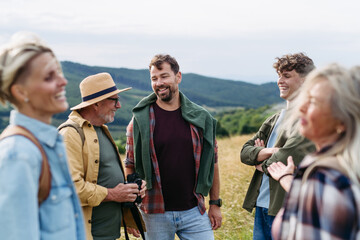 Multigenerational family on hiking trip in nature.