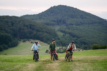 Obraz premium Grandfather, father and teen boy on cycling trip.