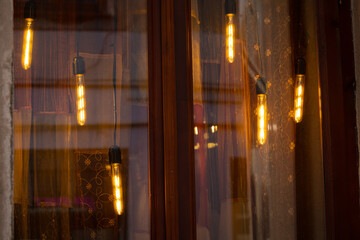 warm bulb garland light window background glass smooth solid surface with slightly reflection from...