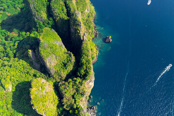 Magical paradise islands with rocks jungle forest on the coast of atoll coral reefs in Andaman Sea view Krabi from above aerial top view drone travel