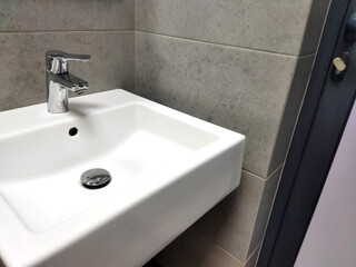 Modern sink design in a minimalist bathroom setup