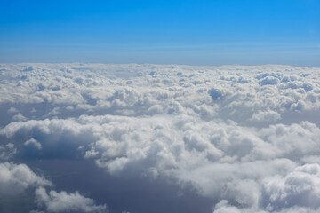 Cloud below and blue sky beyond horizon for background use