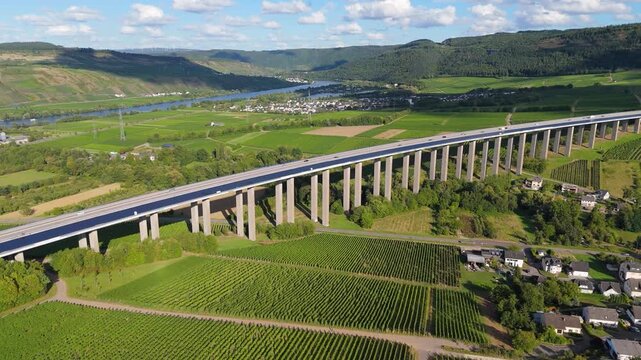 Moselle Viaduct Longuich, vineyard in Mosel valley,  bridge of highway crossing river near Trier, german autobahn, aerial view