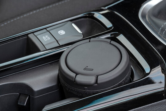 An ashtray on the console of a modern car