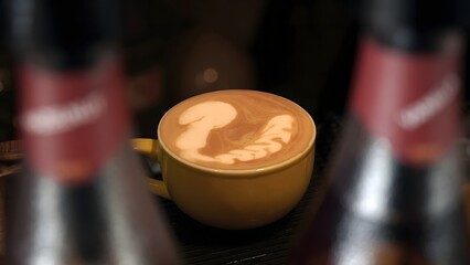 Latte Art A Whimsical Squirrel Design in a Yellow Cup