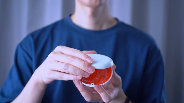Opening orange dental aligner case. Orthodontic Mouthpiece Holder. Slow motion video.