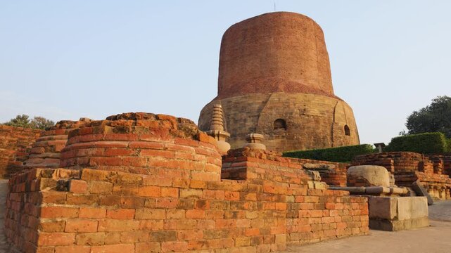 sacred buddhist monument dhamek stupa with ancient bricks remains at sarnath in day video is taken at Sarnath near Varanasi, India.