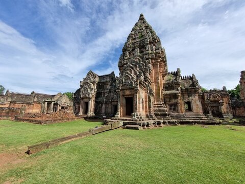Ancient Khmer castle Phanom Rung (Bhanom Rung) plase on themountani. window, sandstone, door, blue, blue sky, yard, design, holy, buddhism, buddhist temple, buddhist, green .