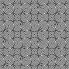 Fototapeta premium Abstract black and white repeating pattern of concentric circles.