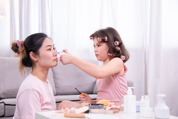Beauty, skincare, cosmetic, mother, daughter shown in laughter and bonding, parenting lifestyle interaction ralationship, blog and social media storytelling, family connection., kid playing with mom