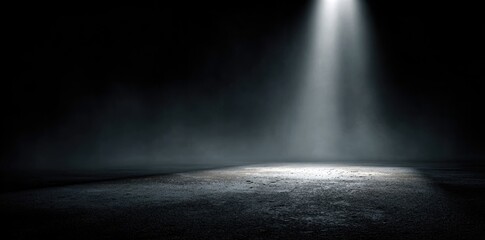 Dark room with spotlight on textured floor