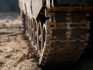 Close-up detail of self-propelled howitzer track and suspension system