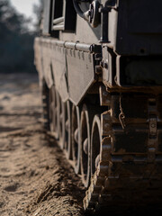 Detailed view of artillery vehicle track system and armored side panels