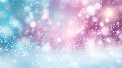 Fototapeta premium A soft, dreamy background with blurred bokeh lights in shades of blue, pink, and white. The scene evokes a winter or festive atmosphere.