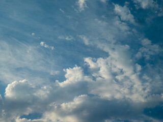 Dramatic Sky with Fluffy and Wispy Clouds.