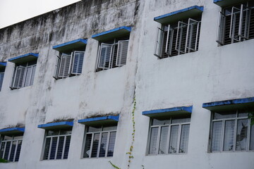 Obraz premium Weathered Apartment Building Facade with Bars