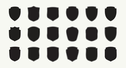 Collection of elegant black shield emblems and badges for modern design projects