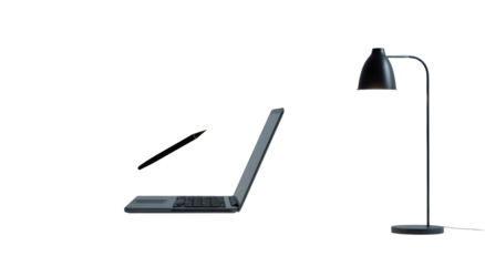 Laptop and desk lamp on dark background