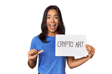 Woman with "crypto art" sign in studio points with thumb finger away, laughing and carefree.
