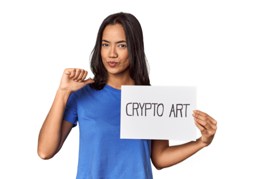 Woman with "crypto art" sign in studio feels proud and self confident, example to follow.