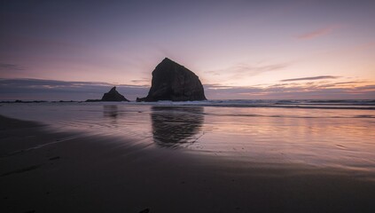 Twilight Majesty. Cannon Beachs Iconic Haystack Rock at Sunset, Oregon Coast.
