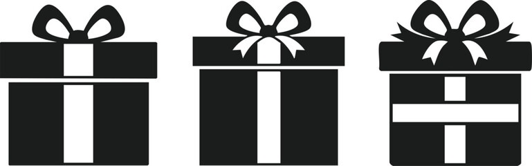 Three stylish black gift boxes with ribbons create a festive, celebratory atmosphere