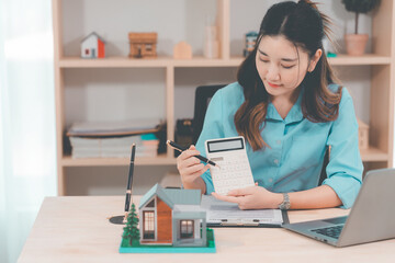 House selling ideas, online consultation with Asian women Real estate concept with wooden house...