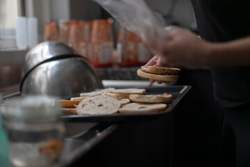 Kitchen preparation scene with sliced mushrooms and bread ready for cooking