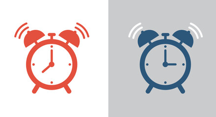 Pair of vintage alarm clocks one red and one blue ringing loudly to wake you up