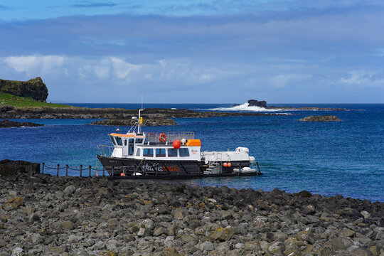 Lunga, Scotland - May 10 2023: A tour boat from "Staffa Tours" on the Isle of Lunga in Scotland. They operate tours to the Treshnish Isles and Iona.
