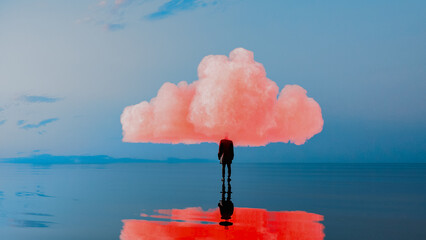 Silhouette of a man beneath a pink cloud over calm sea waters