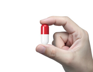 hand holding a capsule