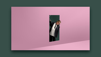 Bold poster. Businesswoman peeking through doorway on pink wall with curious emotion. Concept of discovery, workplace opportunity, web design 2.0, modern fashion style and professional decision making