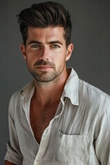 Fototapeta premium Closeup of man with short dark hair and trimmed beard indoors