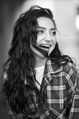 Smiling woman in black and white, showing genuine happiness