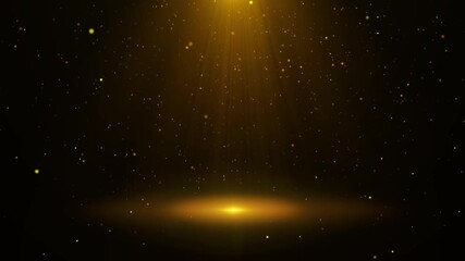 A stage with falling golden particles and lights.