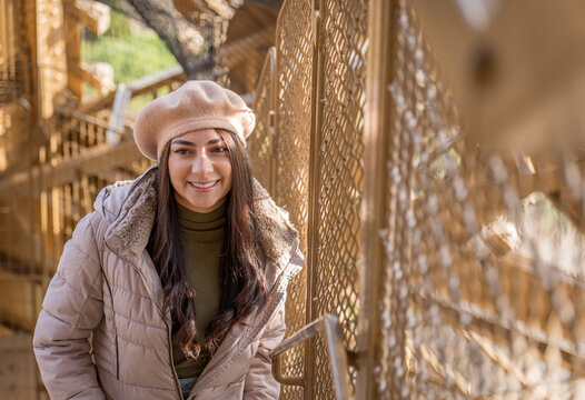 Woman exploring the Eiffel Tower on a sunny winter morning