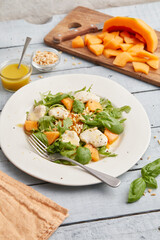 Mozzarella melon arugula salad