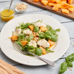 Mozzarella melon arugula salad