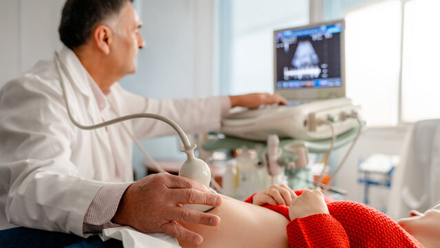 Ultrasound examination of pregnant woman at clinic