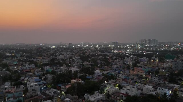 A sweeping night shot of a sprawling city. The illuminated streets and buildings create a dynamic, shimmering pattern. Ideal for capturing urban energy and population density. in Chennai City