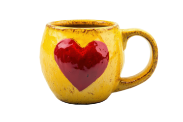 Yellow ceramic mug with red heart design isolated on transparent background. Yellow ceramic mug with red heart design isolated on white background.