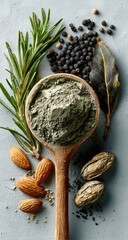 Wooden spoon holding grey powder, surrounded by herbs, spices, and nuts