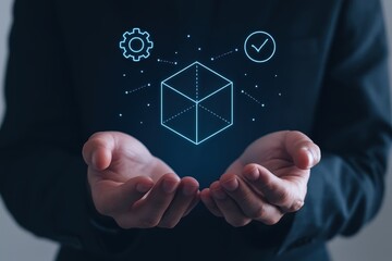 A person's hands hold a digital cube graphic, featuring design elements and a validating checkmark, conveying innovation and technological advancement.