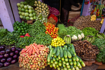 Vibrant vegetable stall in a rural Indian market. The colorful, abundant produce is excellent for food photography, texture reference, and cultural environment design.